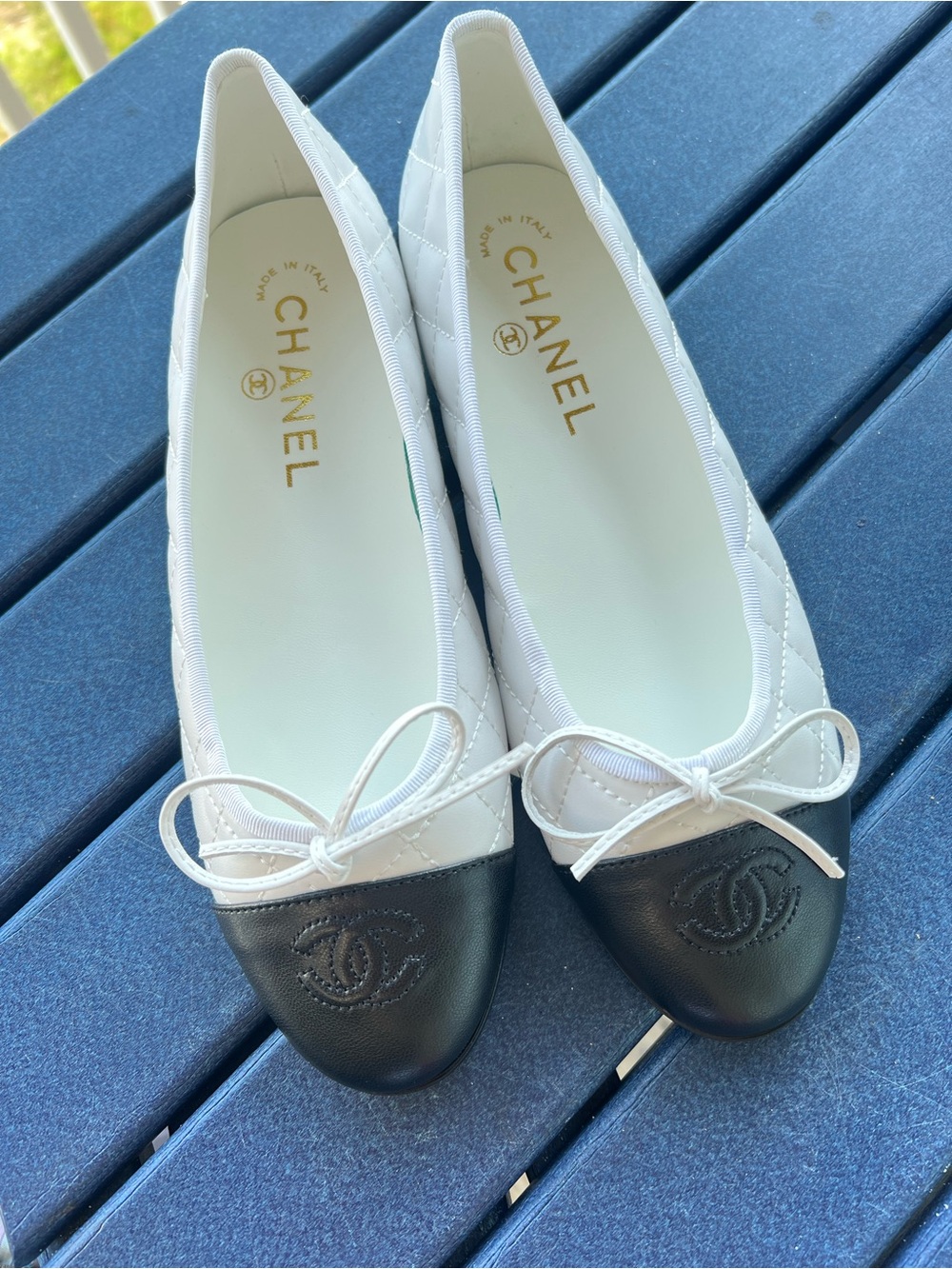 CHANEL White Quilted Leather Ballet Flats with Black Cap Toe